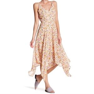 ROMEO & JULIET COUTURE Asymmetrical, flowy medium midi.